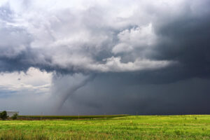 Tornado forms over an open field