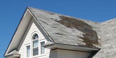 Wind damage removed shingles from roof