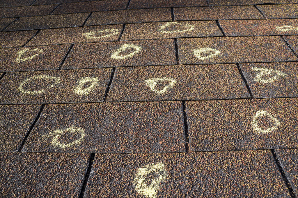 hail damage marked on a roof