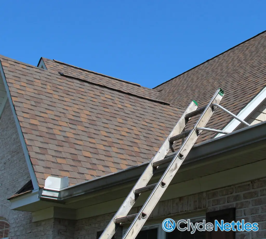 Ladder on roof for a roof inspection from Clyde Nettles